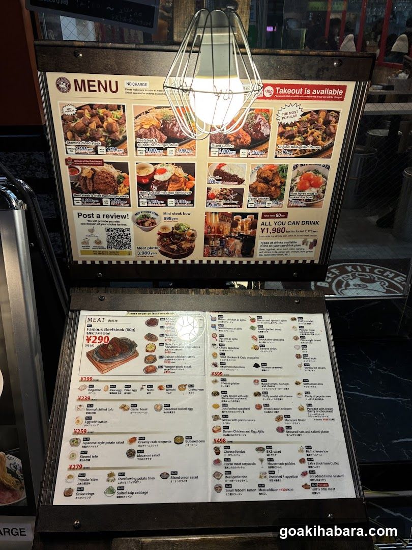 A wooden menu stand with a top section showing food photos and a bottom section listing meat dishes with prices in SGD.