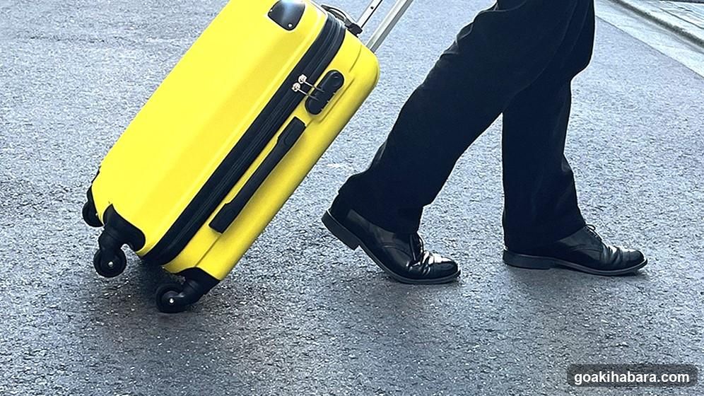 Yellow Suitcase Being Pulled