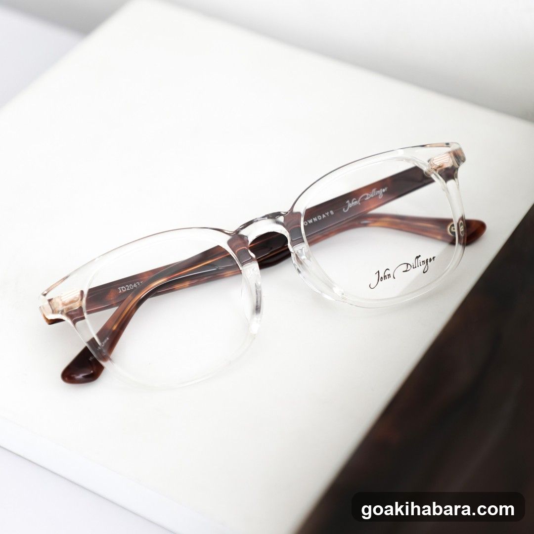 John Bullinger Glasses on White Surface