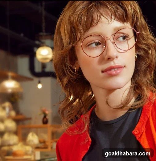 Woman with glasses in a bakery interior