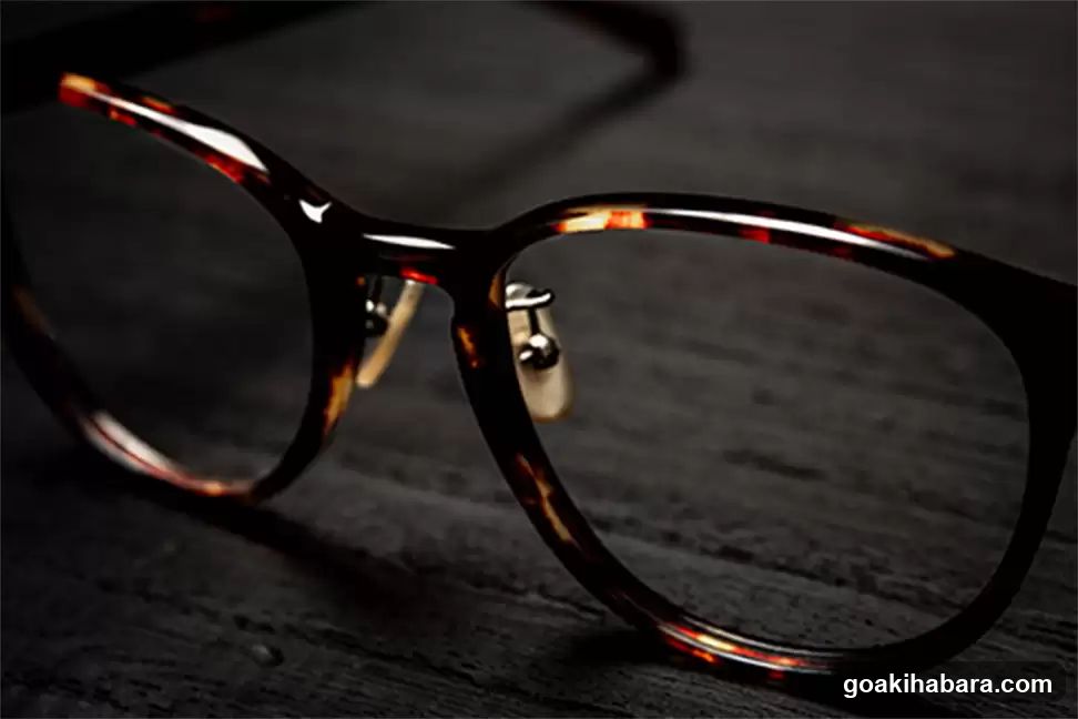 Tortoiseshell Eyeglasses on Dark Surface
