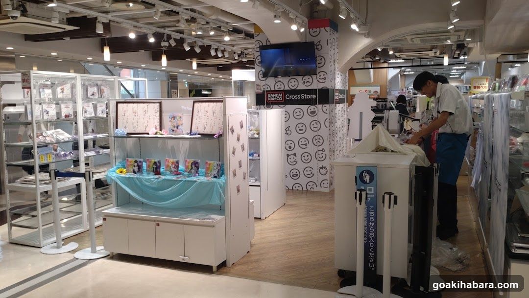 Interior of a store with merchandise displays and staff