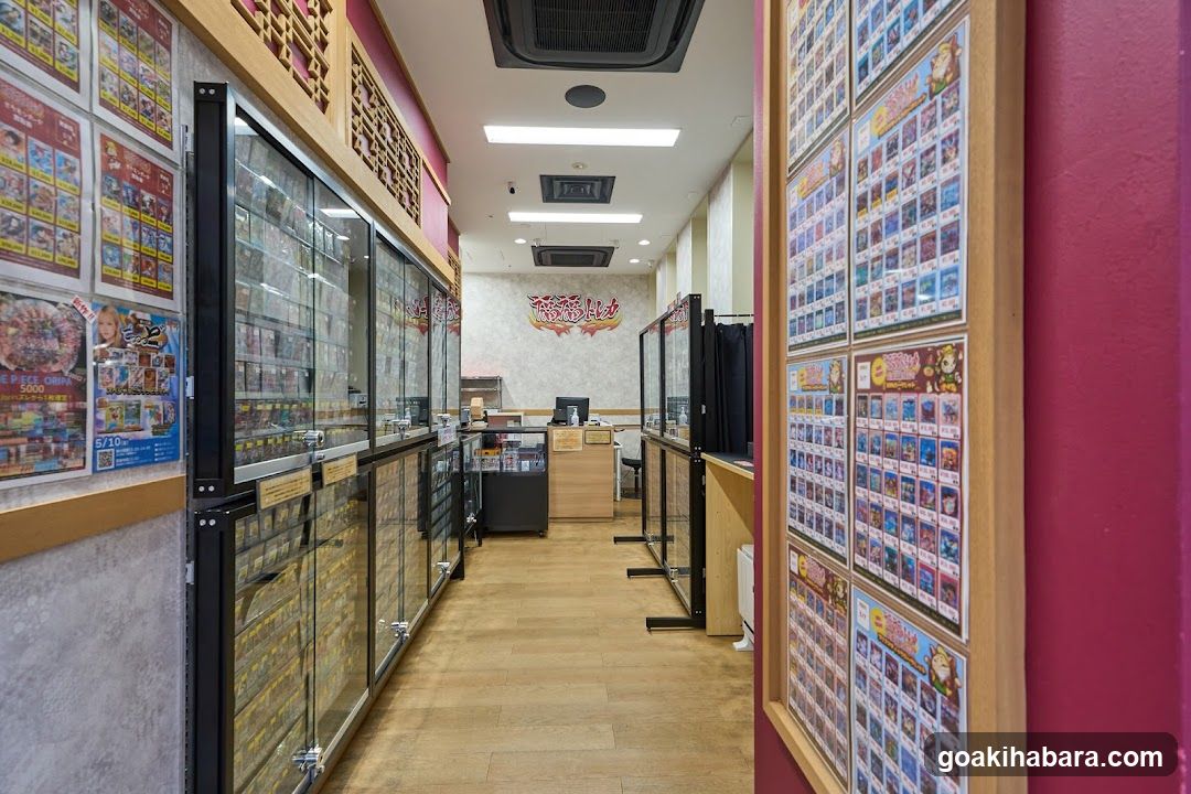 Interior of a shop with glass display cases and posters