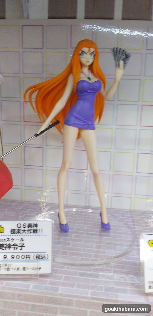 Figure display with price tag