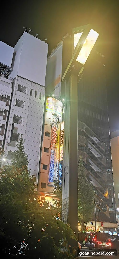 Night street scene with illuminated building facade