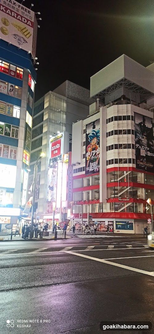 Night street scene with illuminated buildings and advertisements