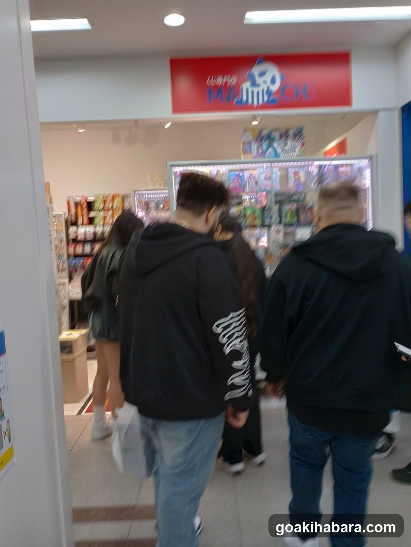 Crowd entering store with red sign