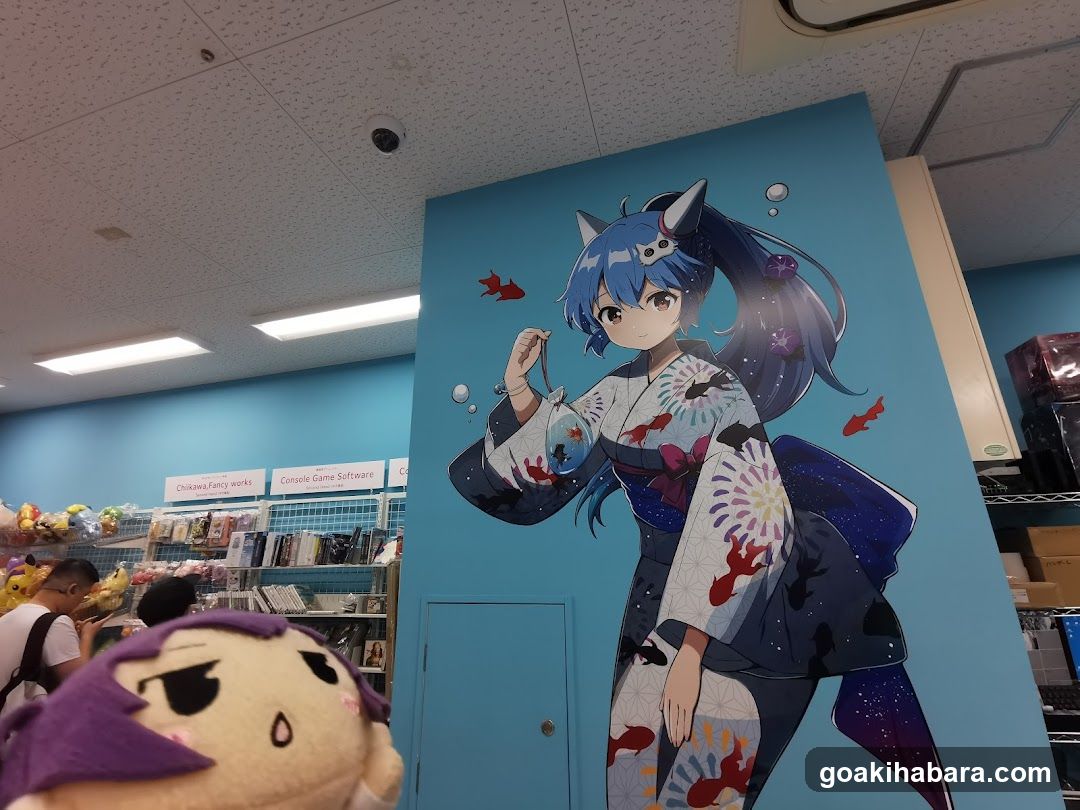 Anime-themed store interior with character mural