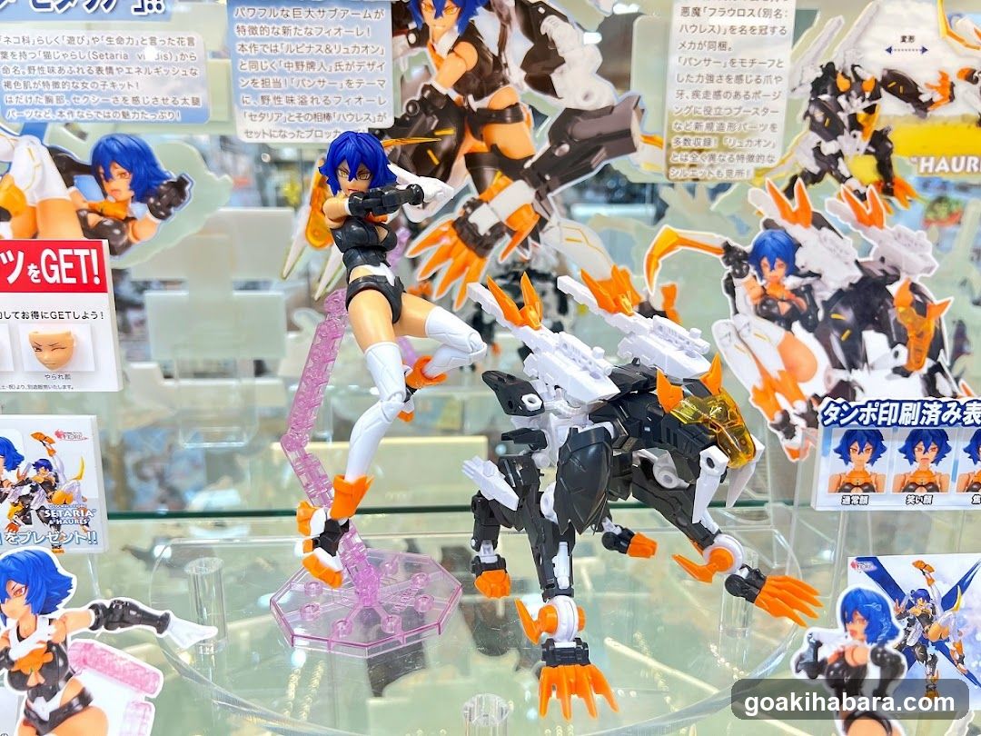 Figure display case with action figures and packaging