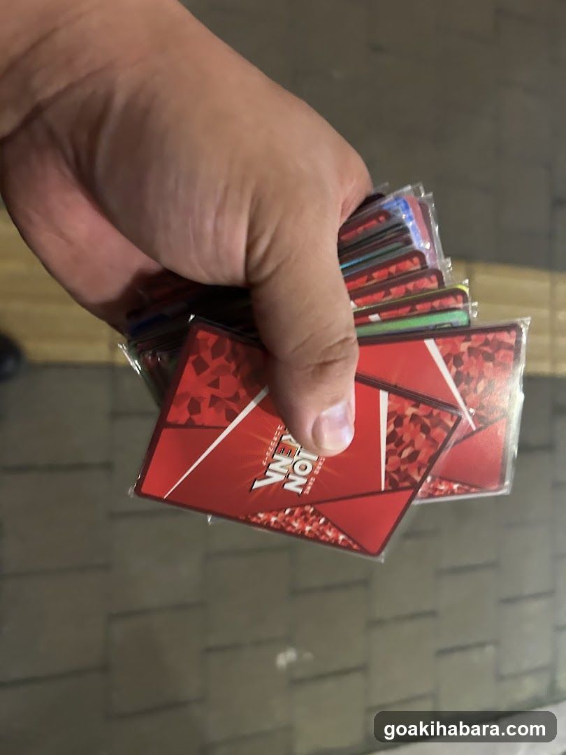 Hand holding red cards