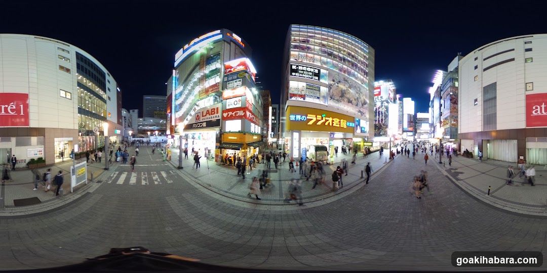 Night Street Scene with Shops and Crowds