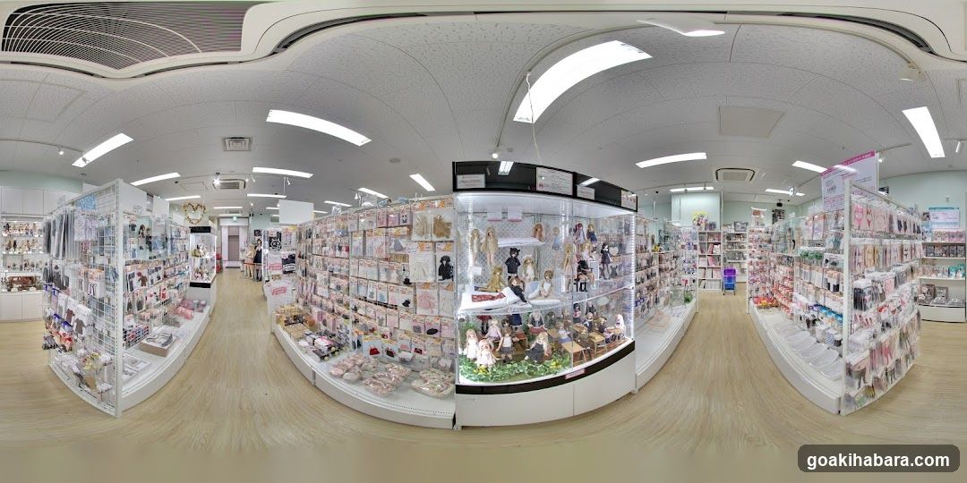 Interior of a retail store with glass display cases and shelves filled with merchandise.