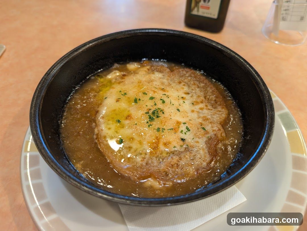 Bowl of Soup with Cheese and Herbs