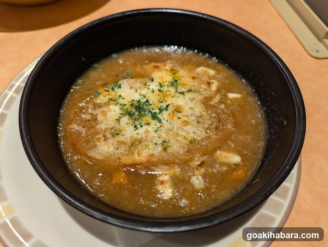 Bowl of Soup with Cheese and Herbs