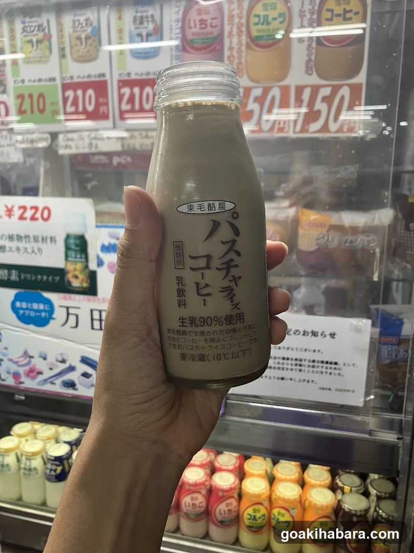 Hand holding a bottle of East Meiji Past Chazas Coffee