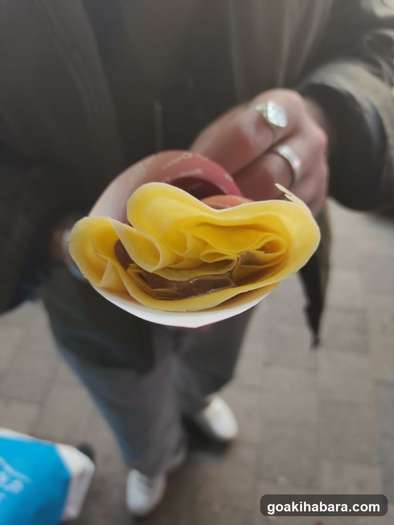 Handheld food item in cup
