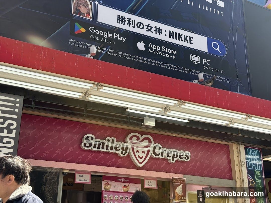 Smiley Crepes storefront with digital ad above