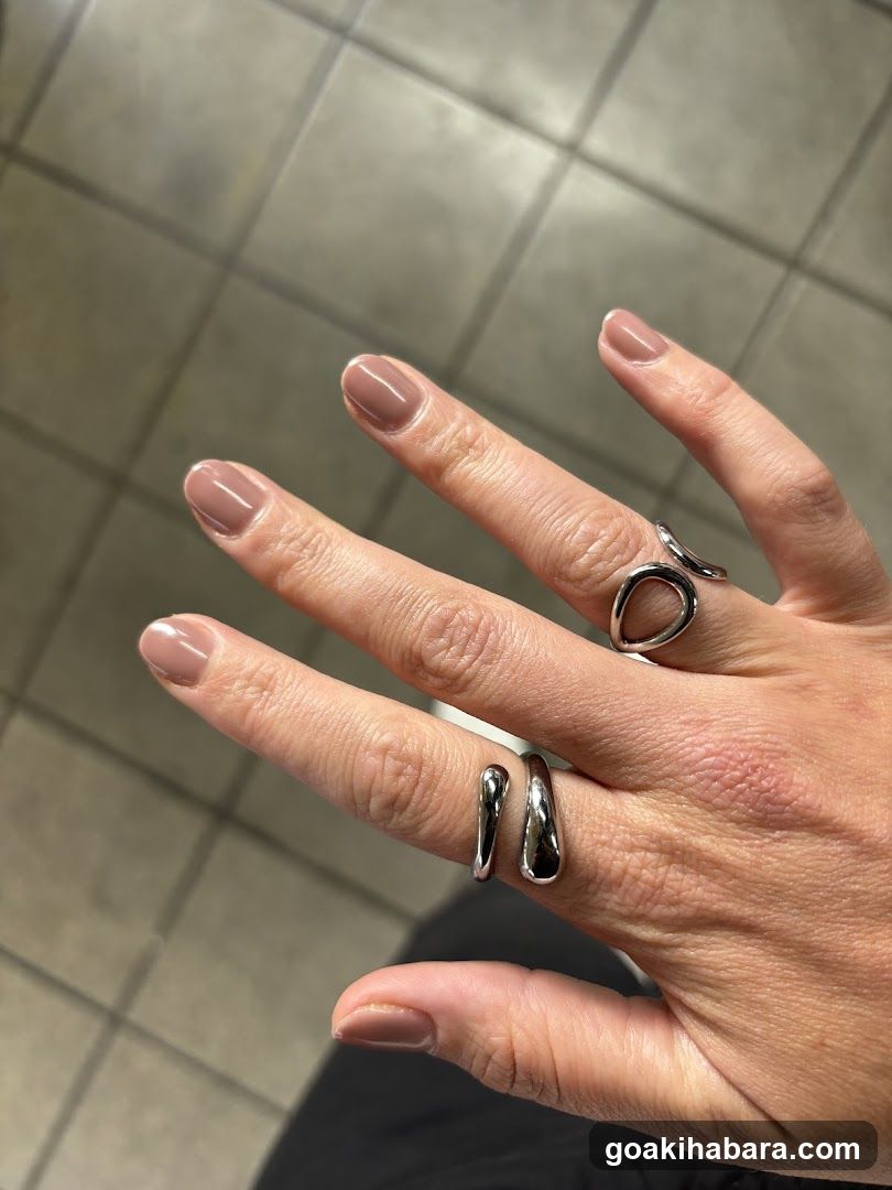 Hand with rings and manicure