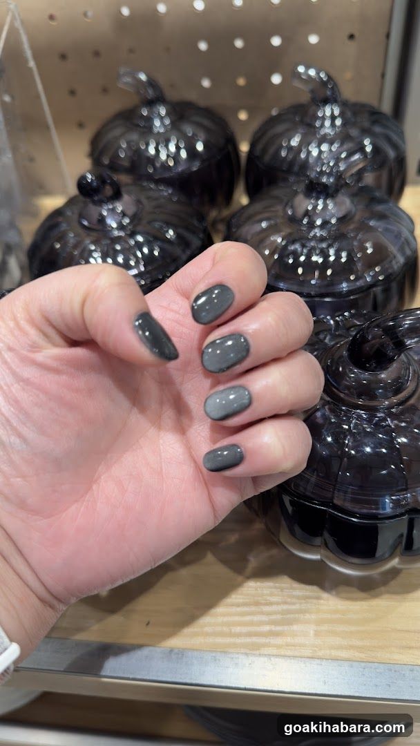 Hand with Gray Nails in Store