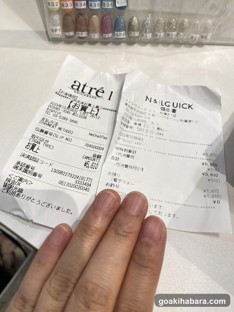 Receipts on table with nail polish display