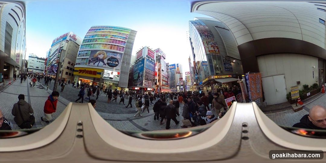 Crowded Urban Street with Billboards and Pedestrians