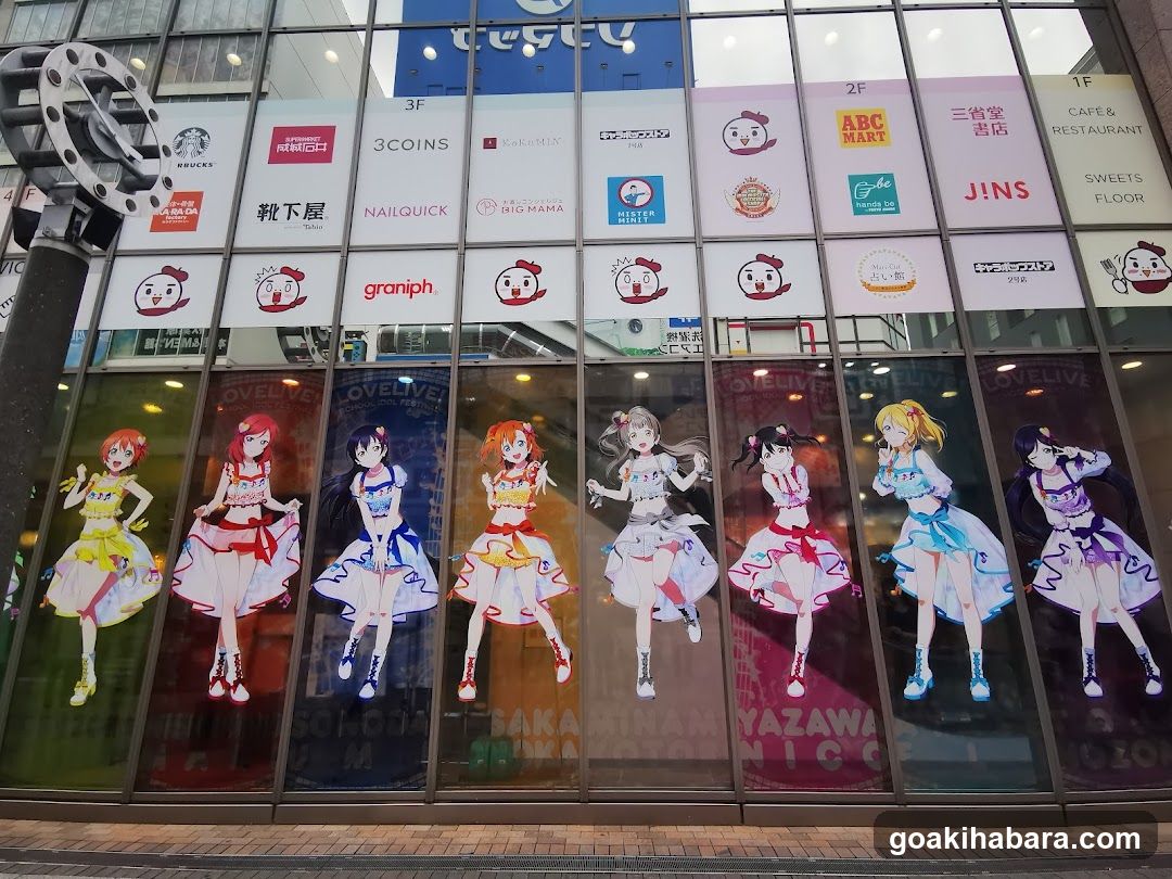 Anime-themed storefront with character decals and brand signage