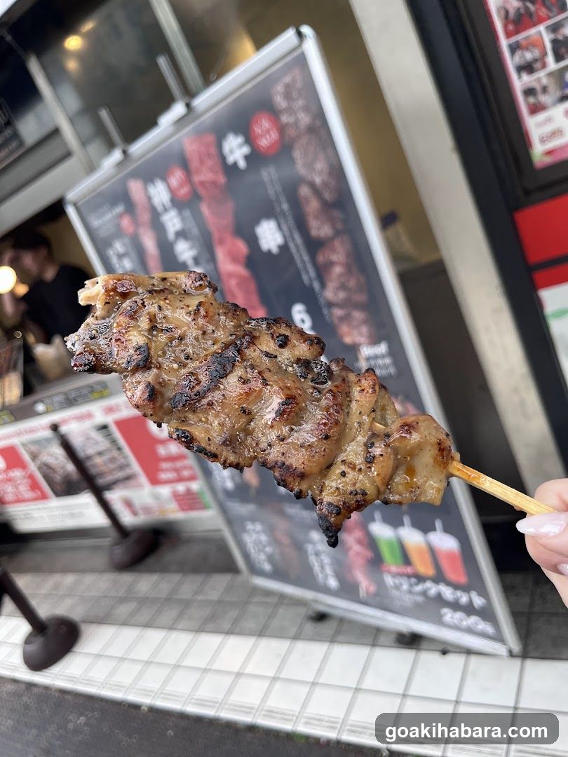 Grilled Meat Skewer in Front of Shop Signage