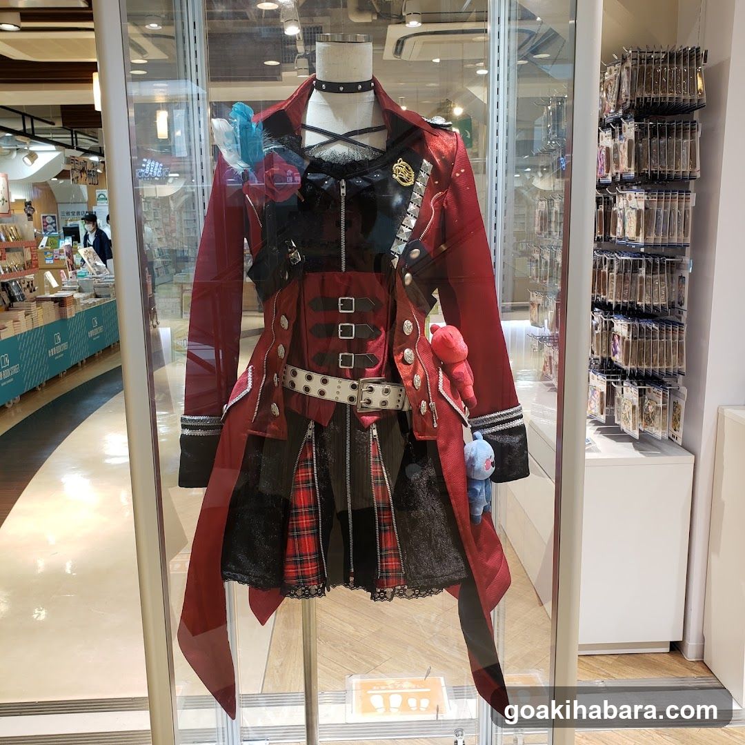 Red and black costume display in store window