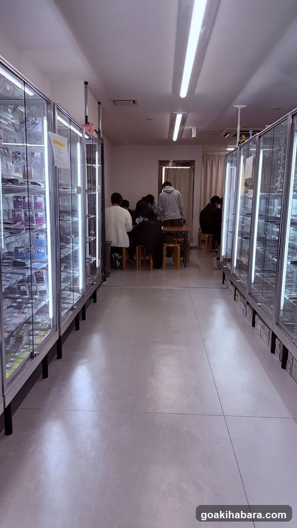 Interior of a shop with display cases and customers