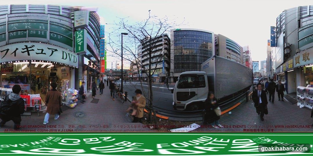 Urban Street Scene with Storefronts and Vehicles