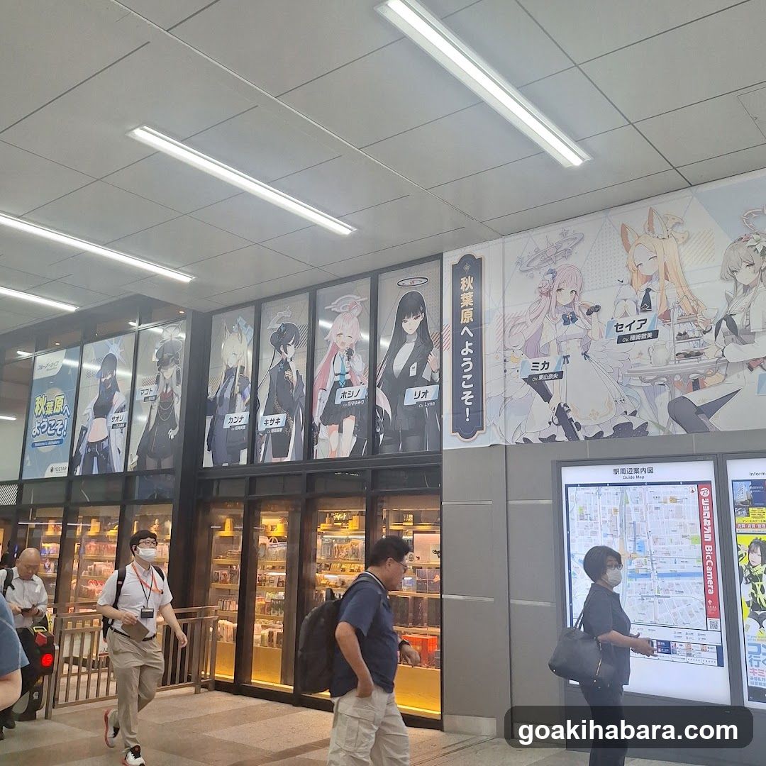 Anime-themed storefront display with characters and map board