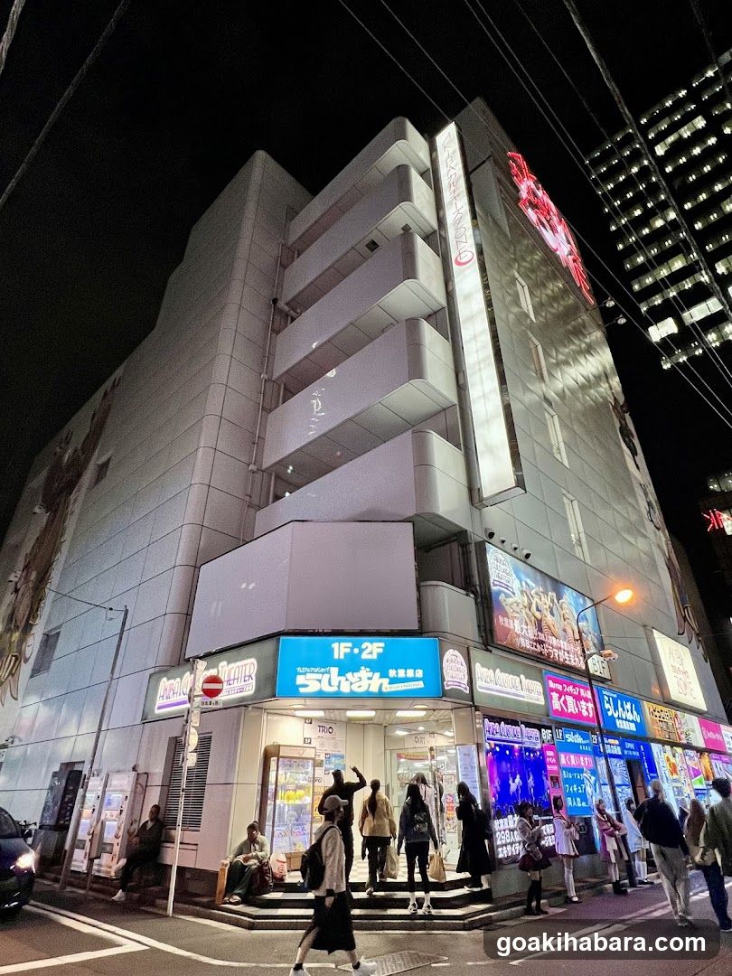 Nighttime street corner storefronts