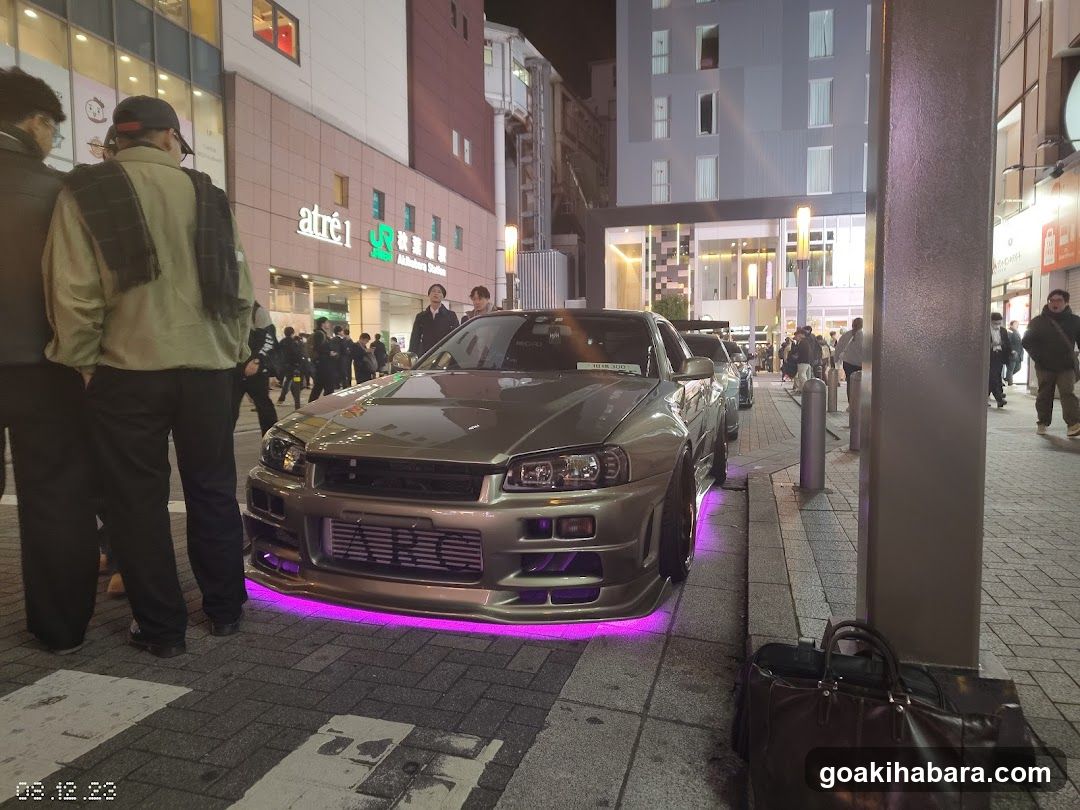 Night street scene with modified car