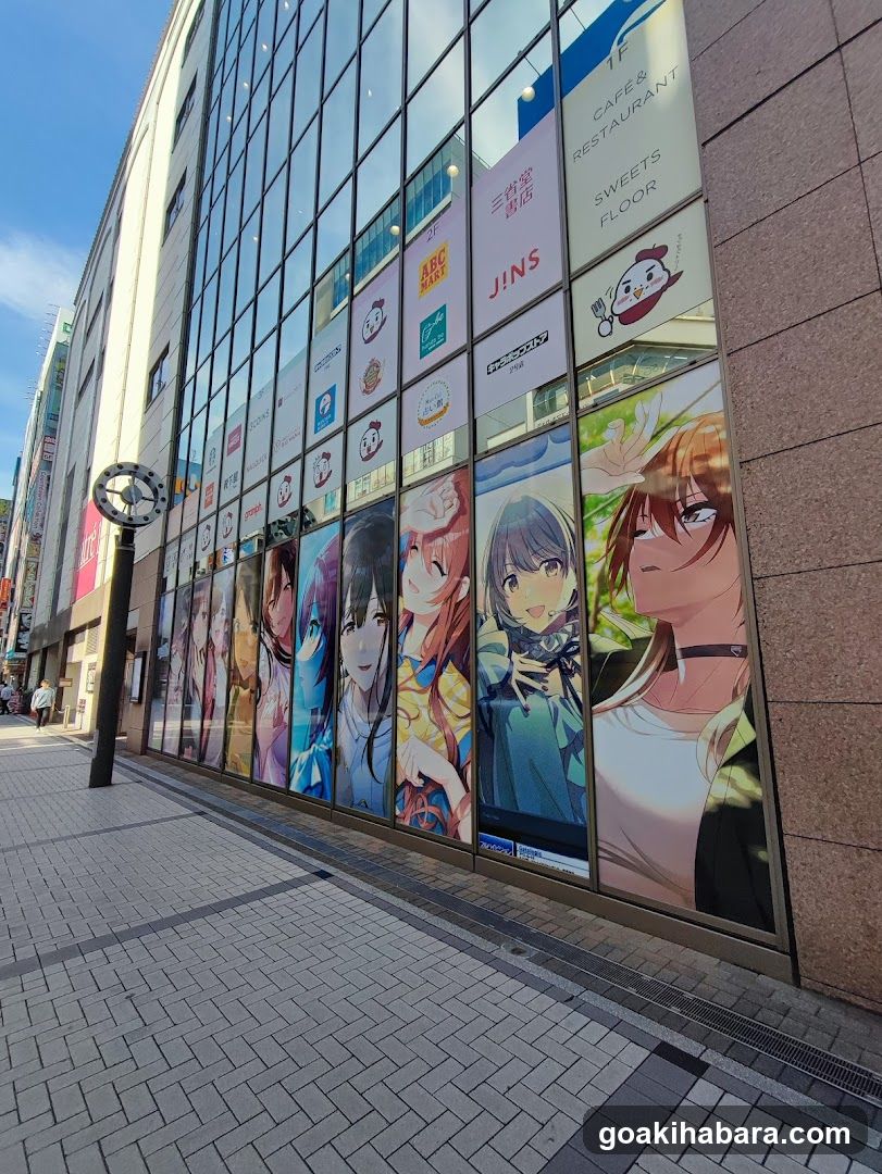 Anime-themed storefront with character posters and shop signs