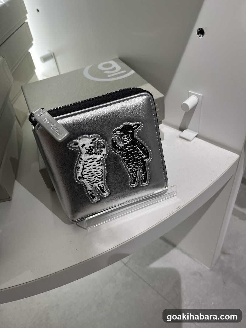 Silver wallet with sheep design