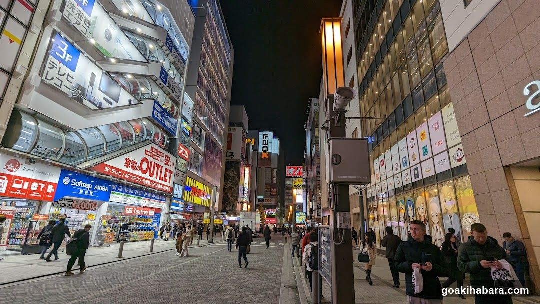 Night Street Scene with Shops and Pedestrians