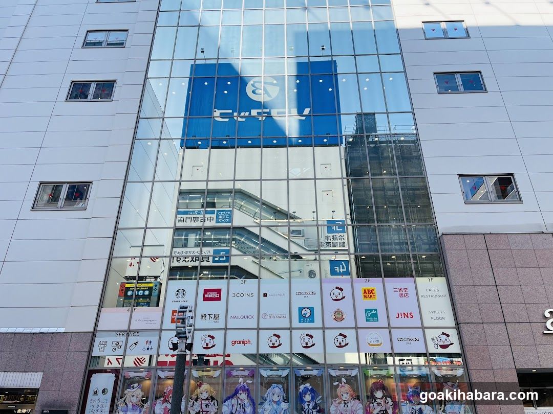 Shopping Center Facade with Storefronts and Anime Merchandise Display