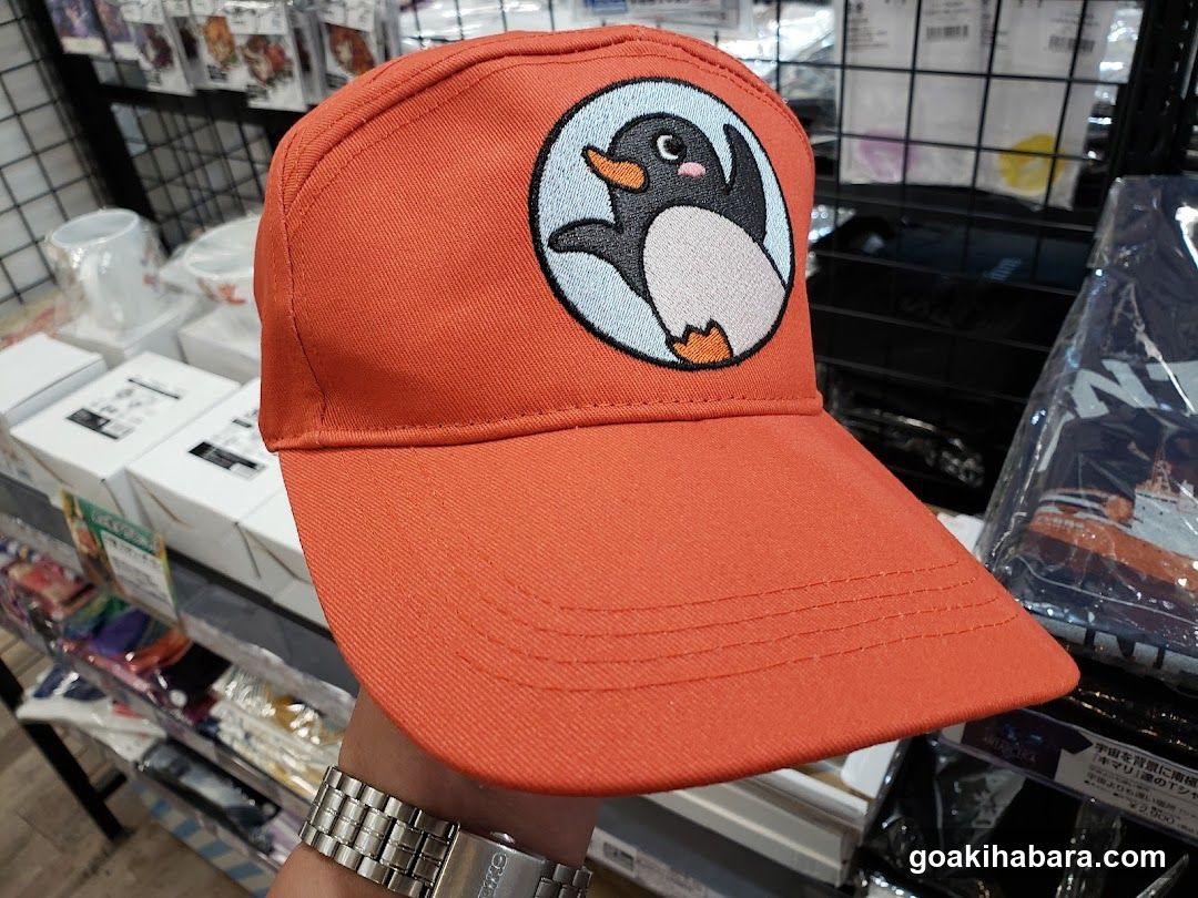 Orange Hat with Penguin Design