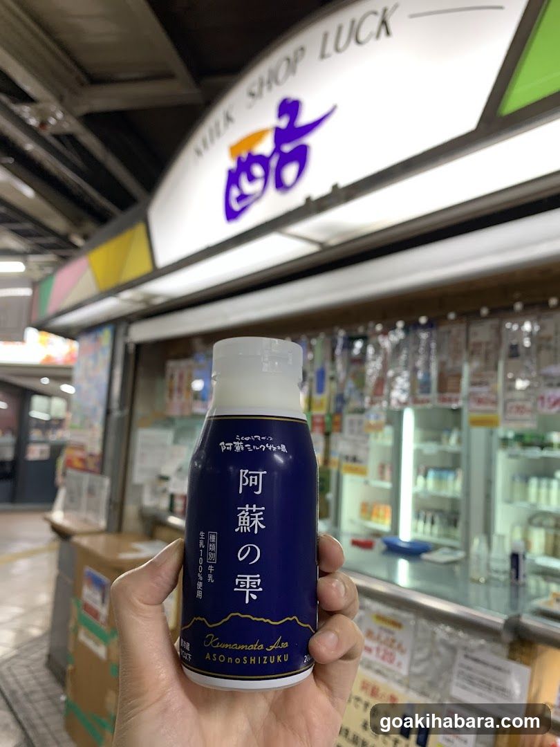 Hand holding Asano Milk in shop interior