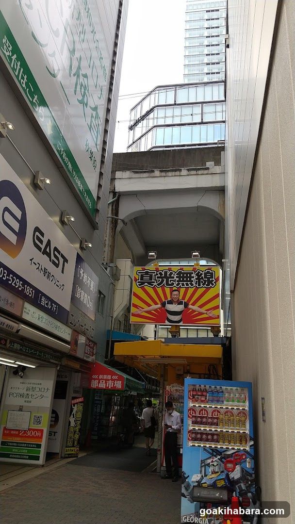 Urban Alleyway with Storefronts and Advertisements