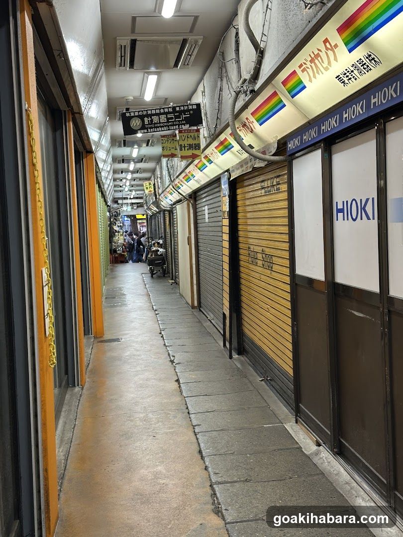 Closed storefronts in a narrow alleyway