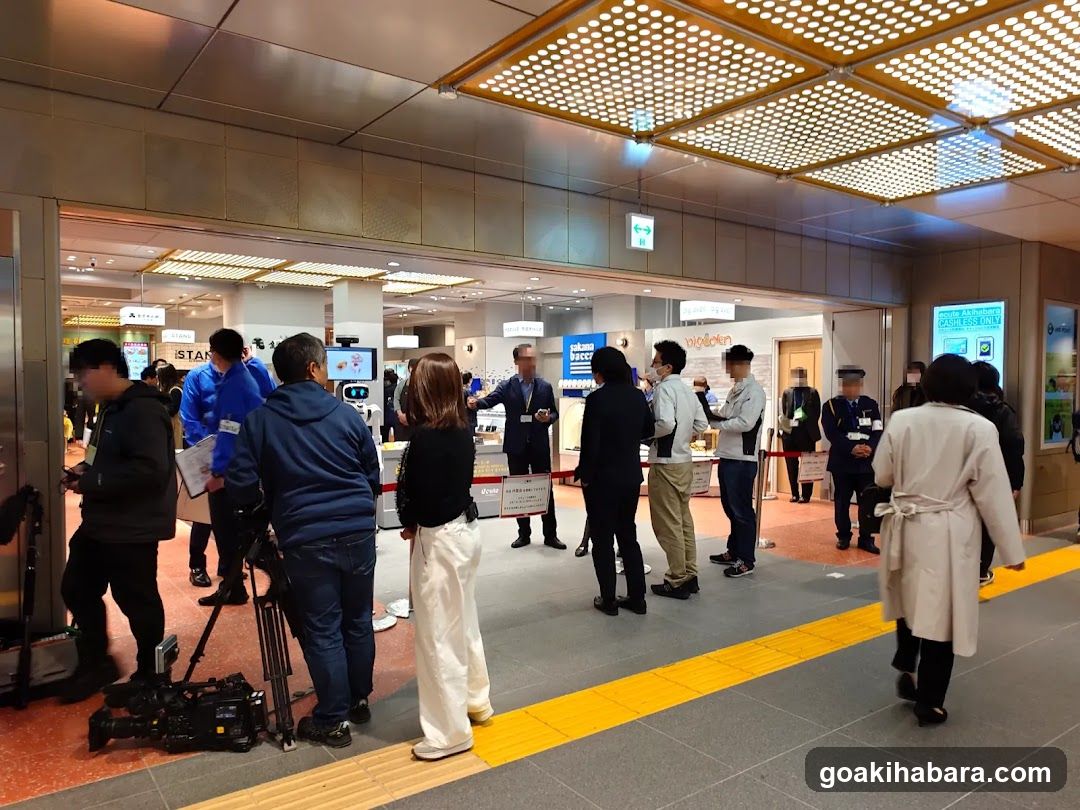 Crowd at a store entrance with media presence