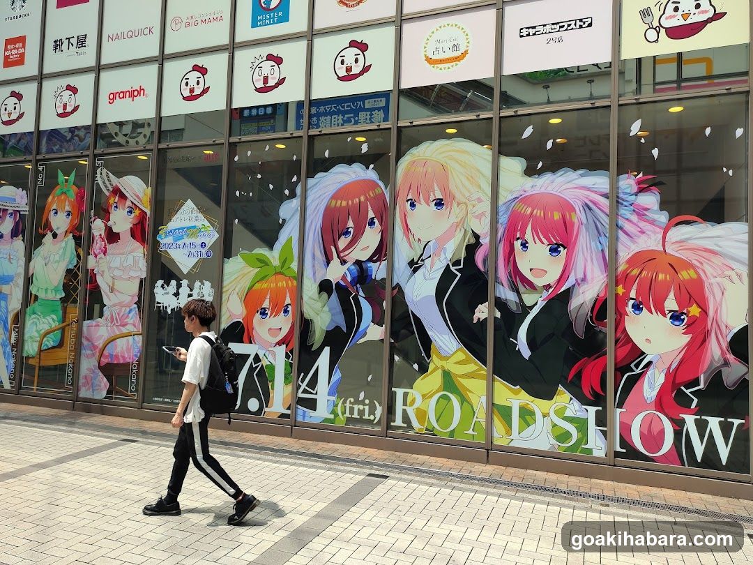 Anime-themed storefront with character posters and signage