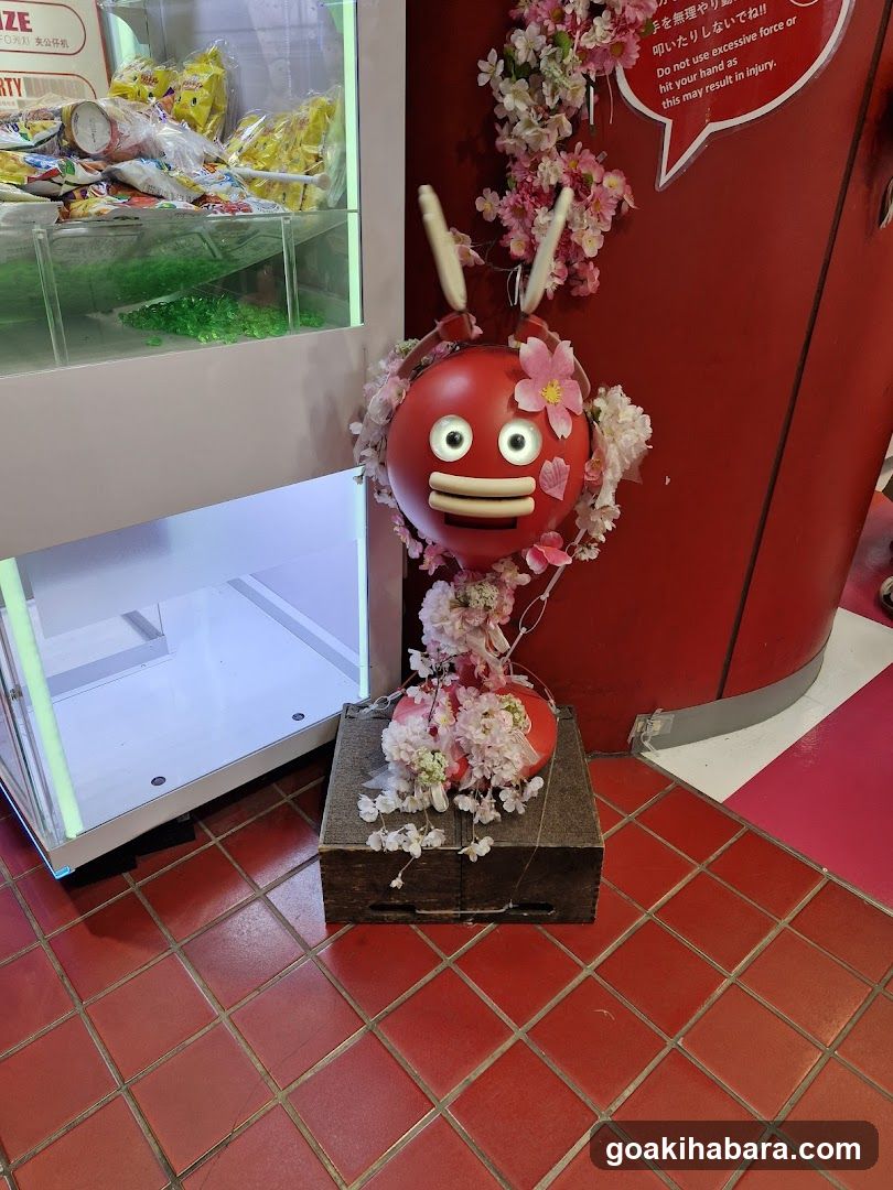 Red character display with claw machine