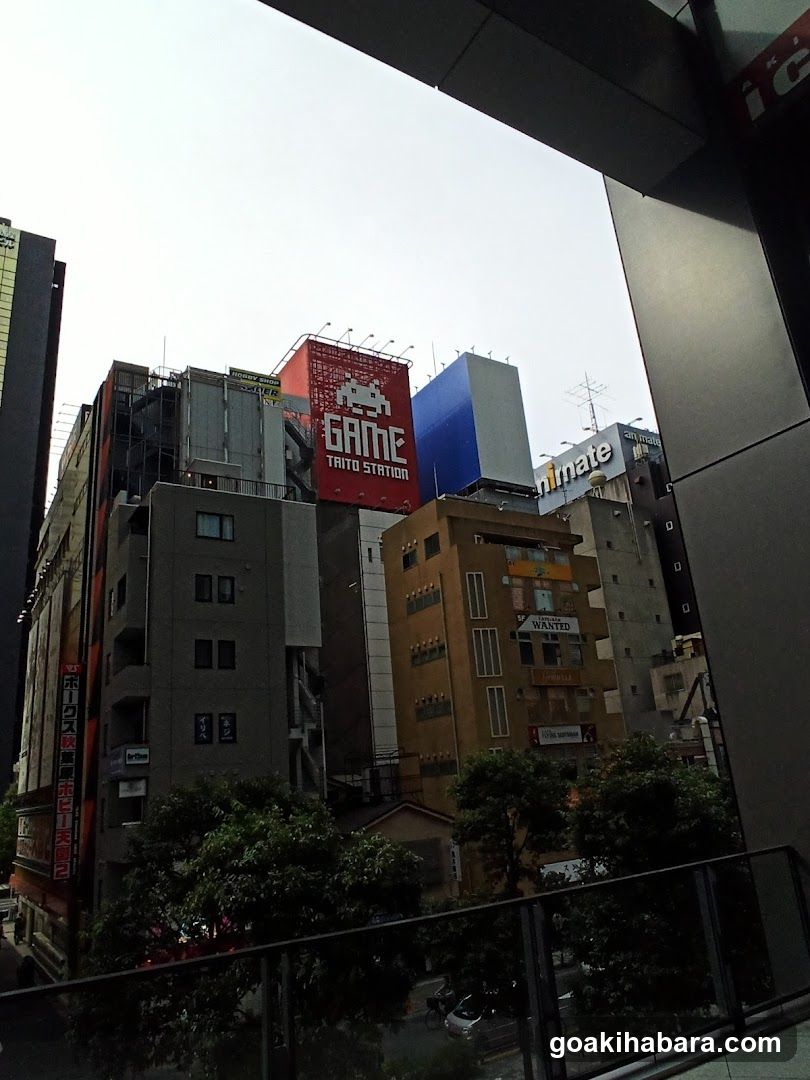 Urban Cityscape with Game and Taito Station Signage