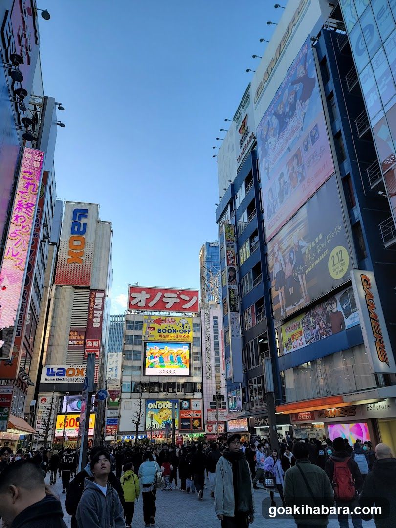 Crowded Urban Street with Neon Signs