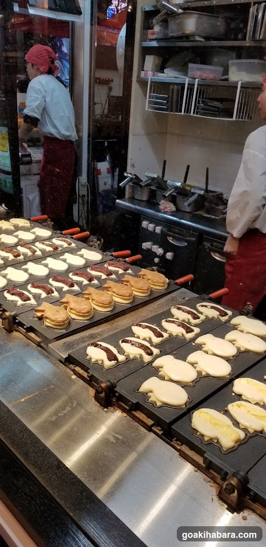 Fish-shaped pancakes being cooked