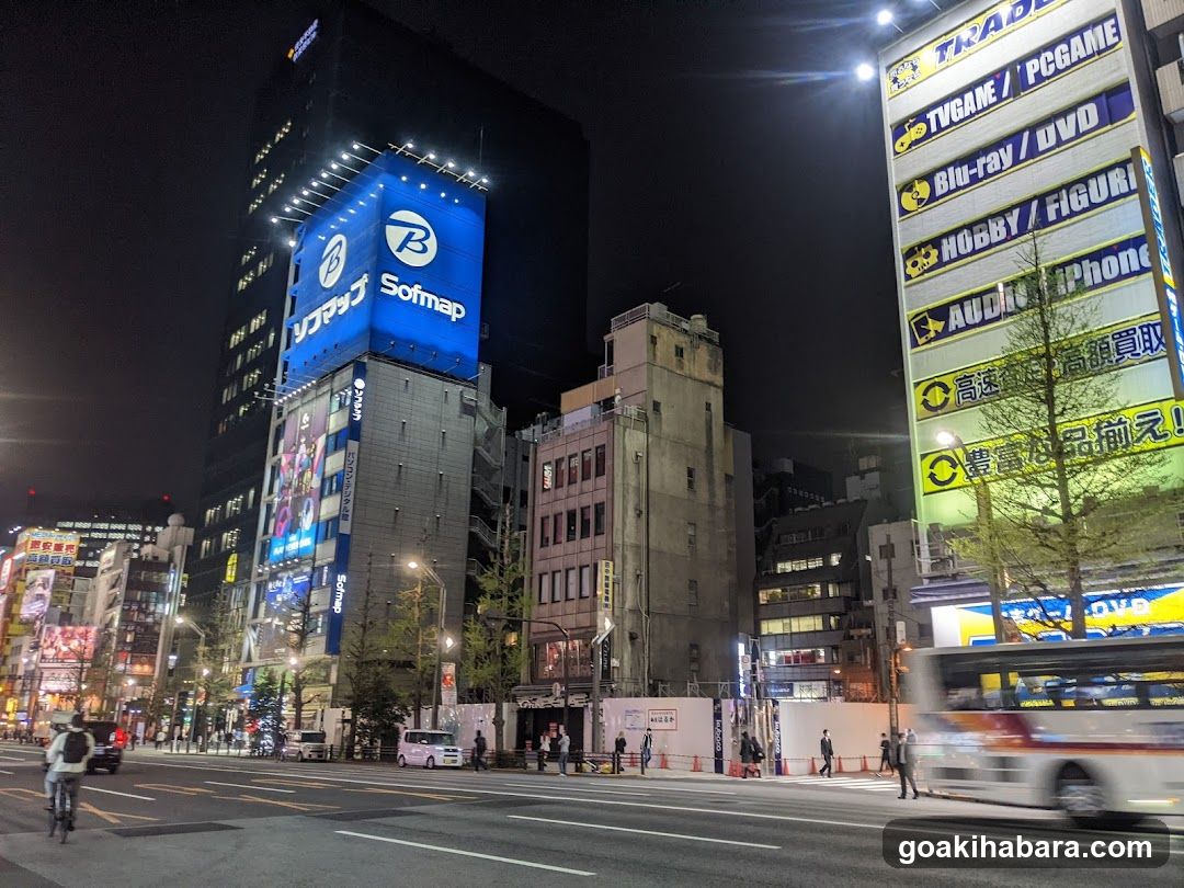 Night street scene with illuminated buildings