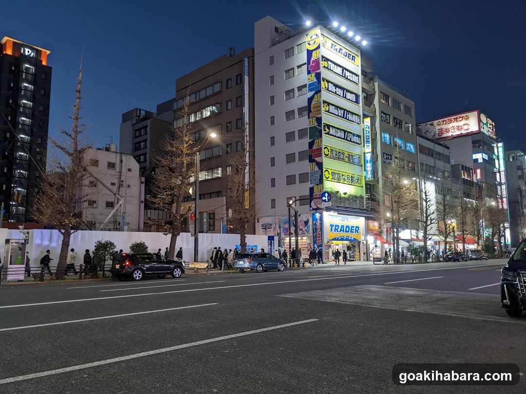 Night street scene with illuminated buildings