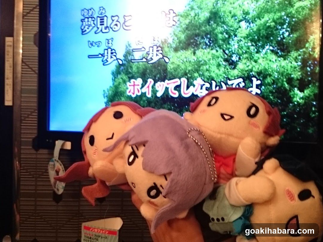 Plushies in front of TV screen
